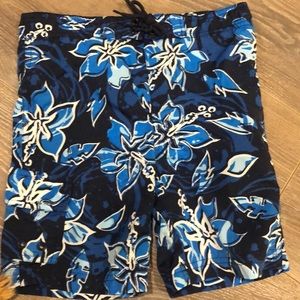 Boys swim trunks, Hawaiian pattern with flowers.